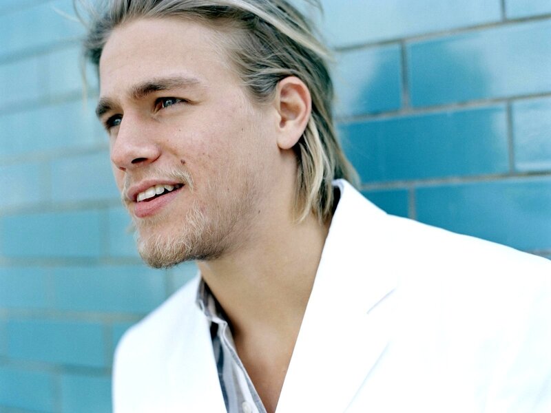 man in white jacket smiling