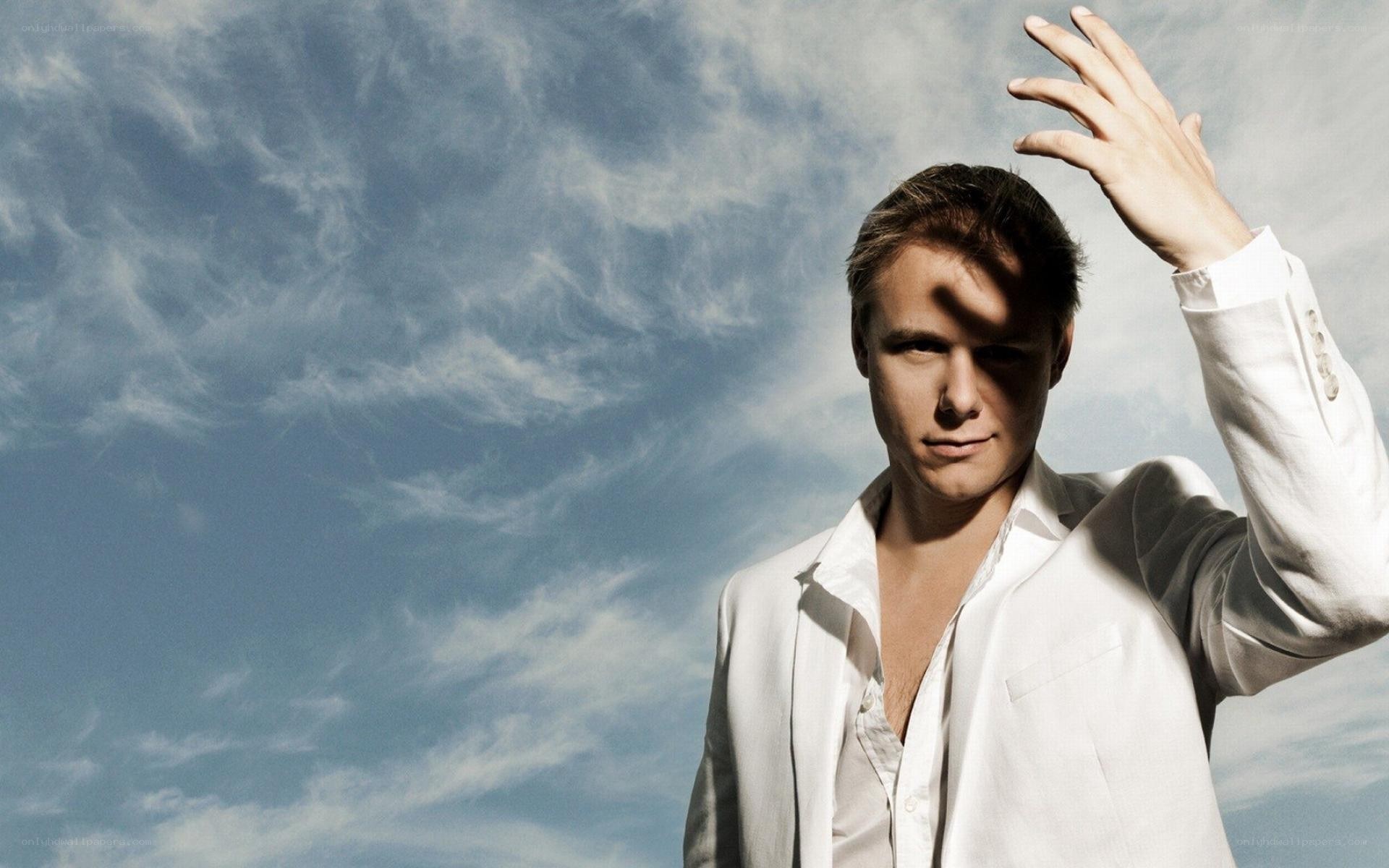 man in white shirt against sky