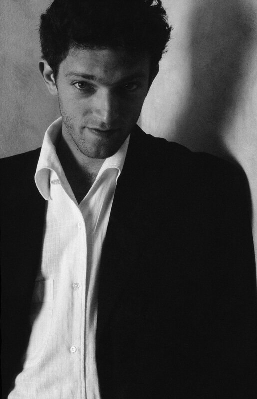 man in white shirt and black jacket
