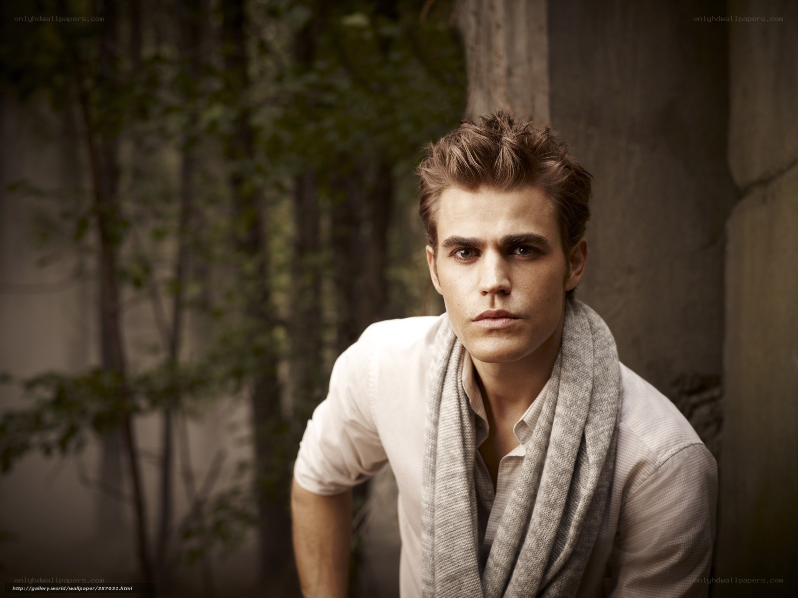 man in white shirt and scarf