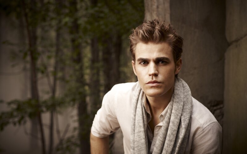 man in white shirt and scarf