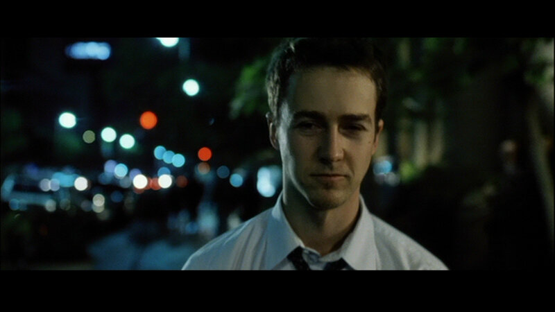 man in white shirt at night