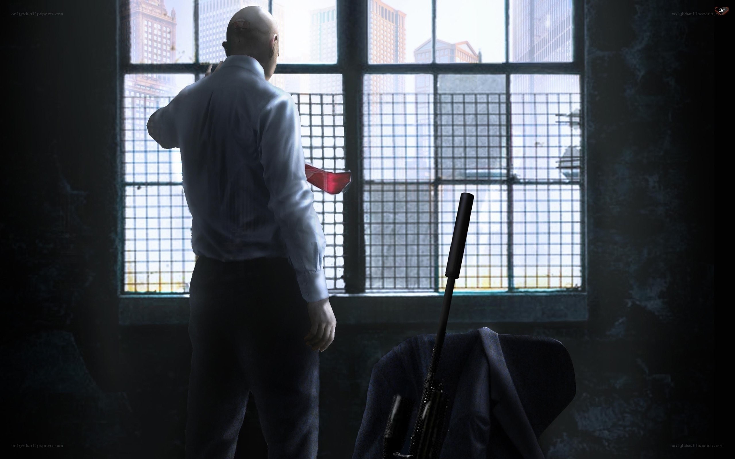 man in white shirt by window