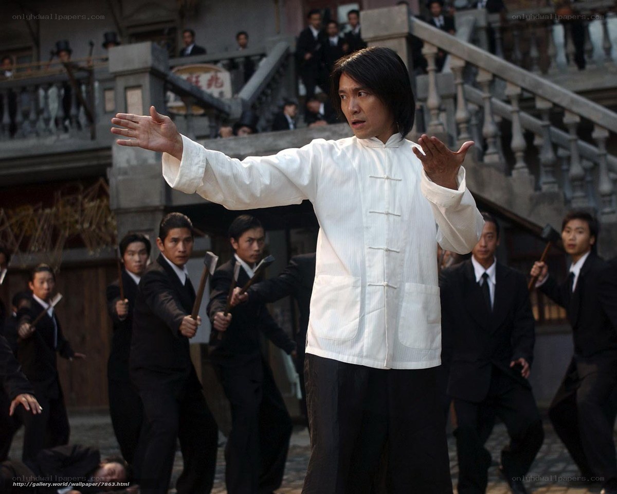 Man in white shirt facing attackers