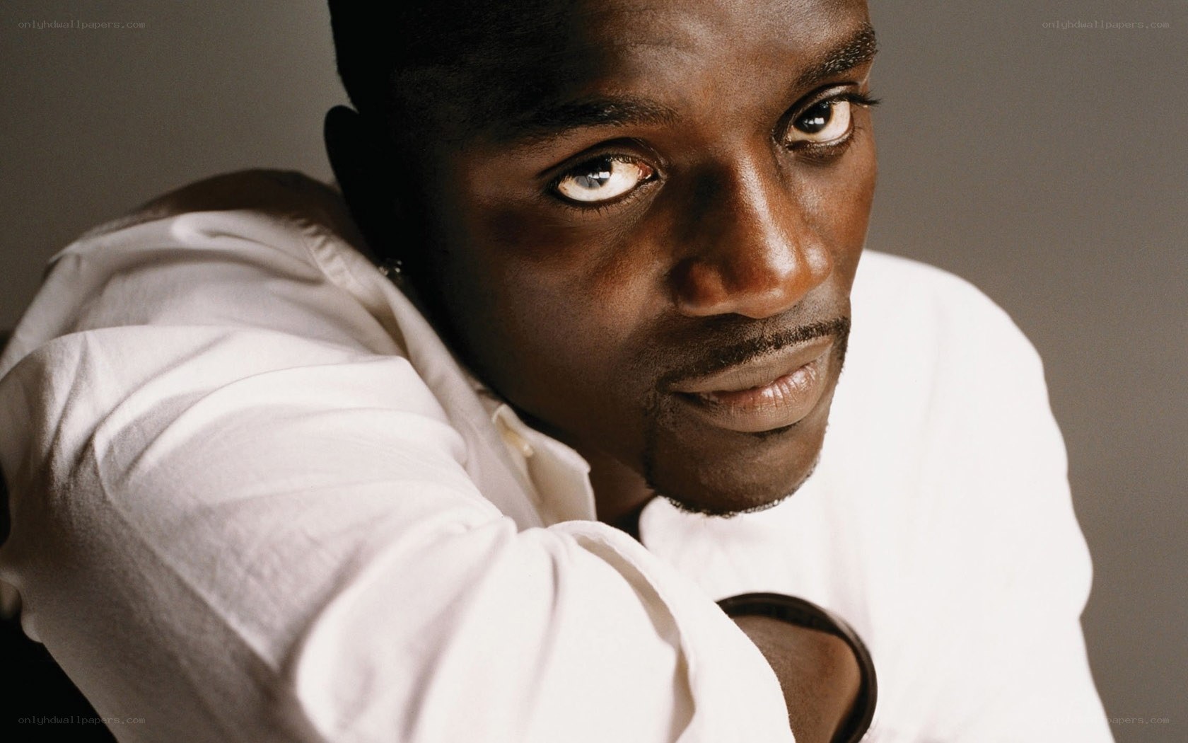 man in white shirt looking at camera
