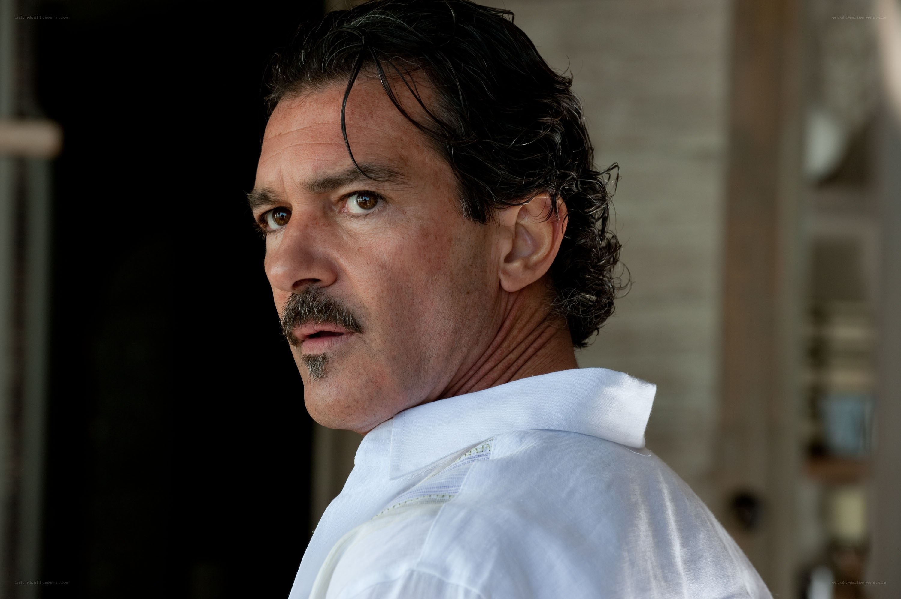 man in white shirt looking back