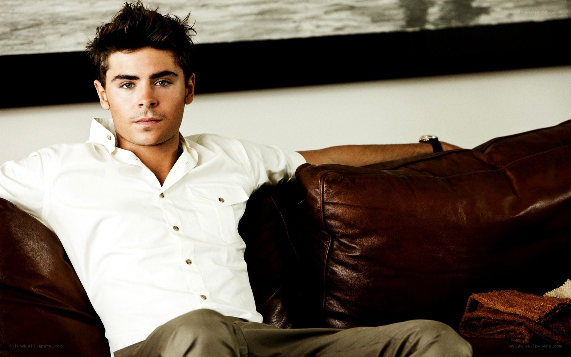 man in white shirt on couch