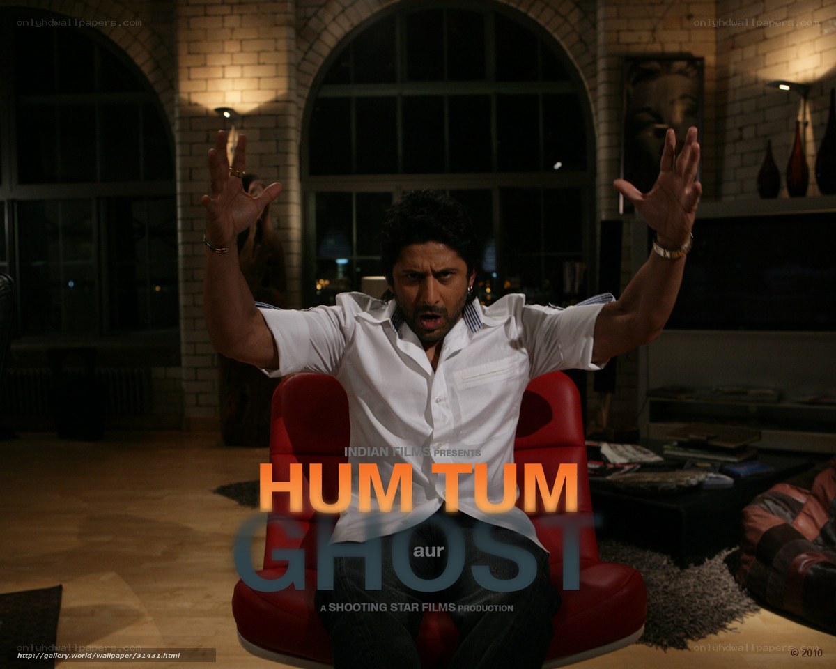 Man in white shirt on red chair