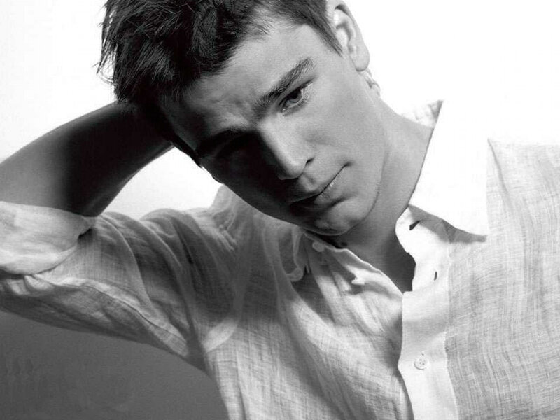 man in white shirt posing