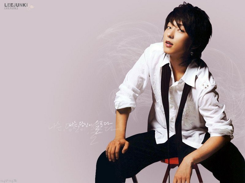 man in white shirt sitting