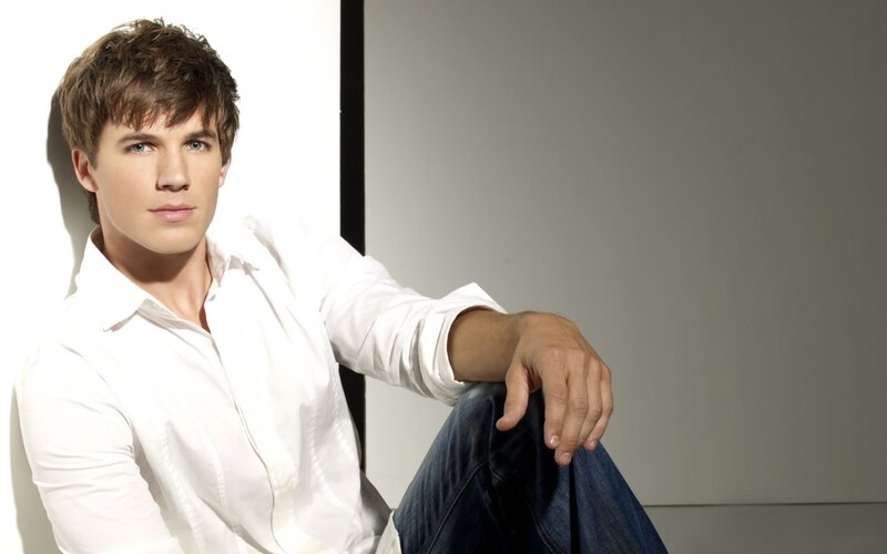man in white shirt sitting