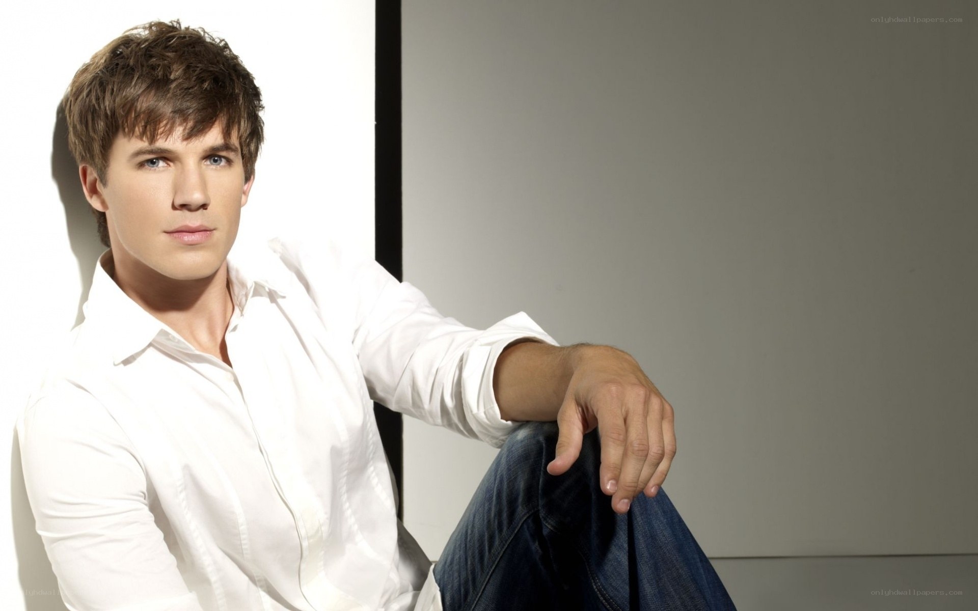 man in white shirt sitting