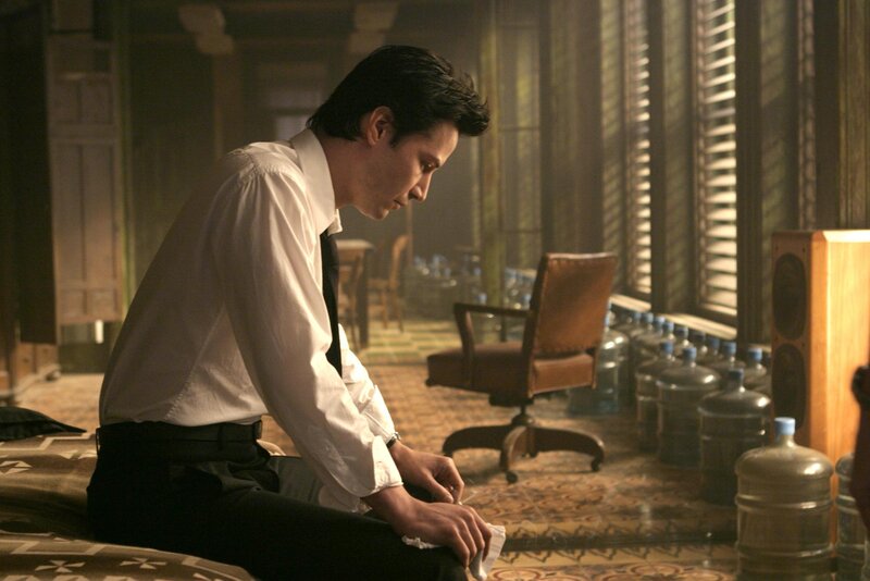 man in white shirt sitting