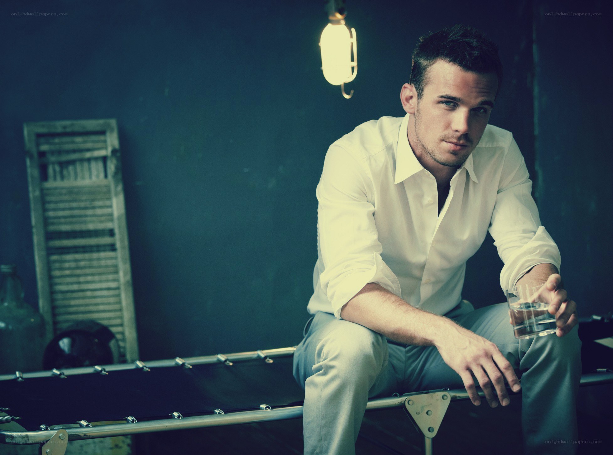 man in white shirt sitting
