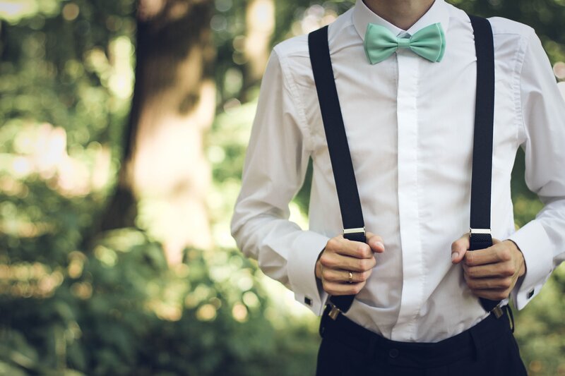 man in white shirt with bow tie