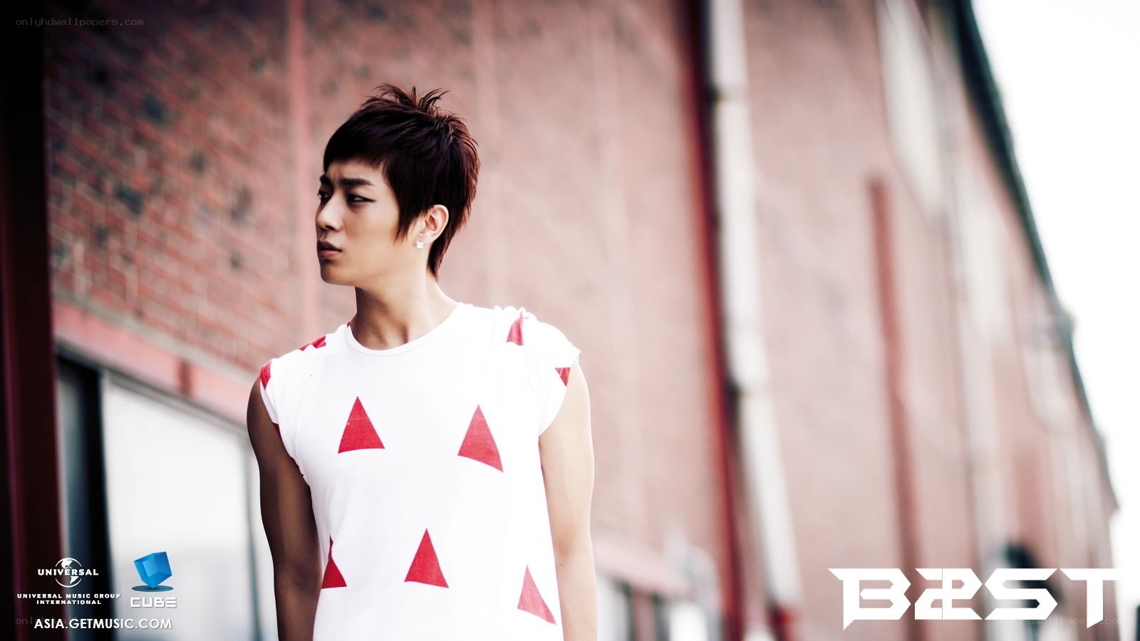man in white shirt with red triangles