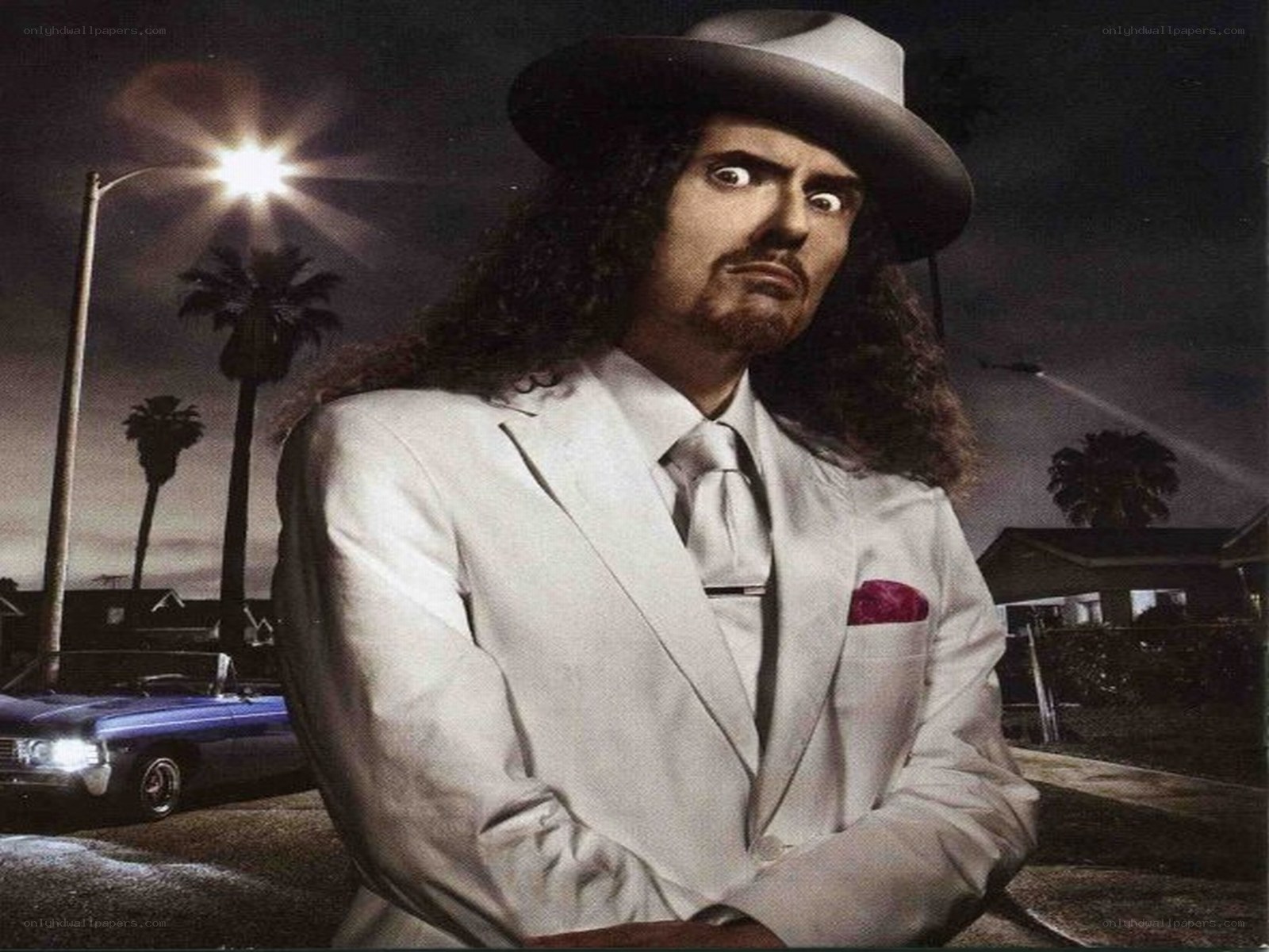 man in white suit at night