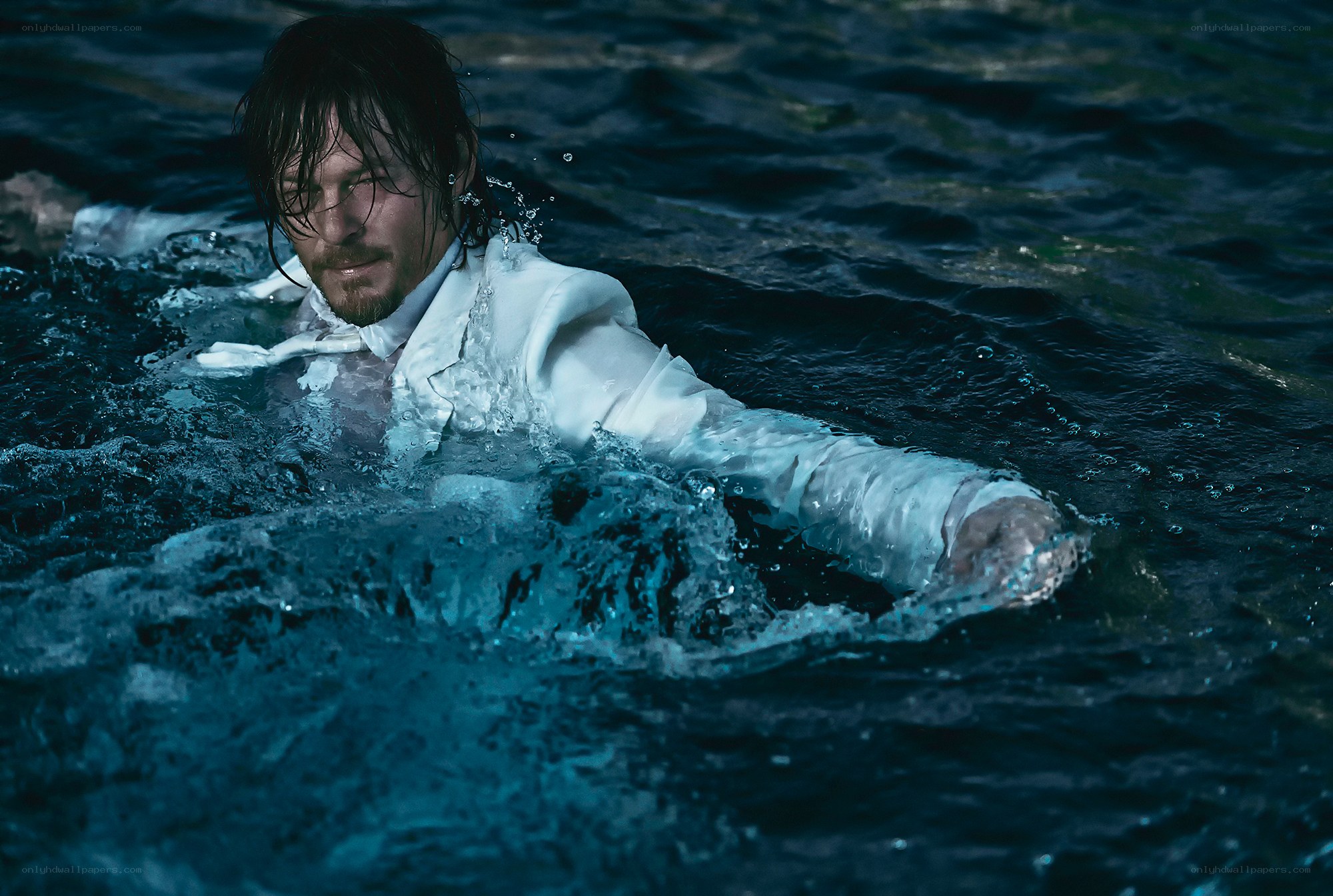 man in white suit in water