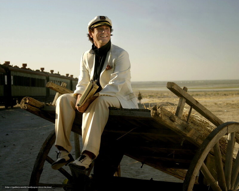 Man in white suit on cart