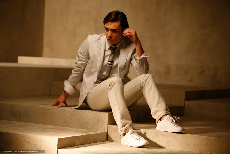 man in white suit on steps