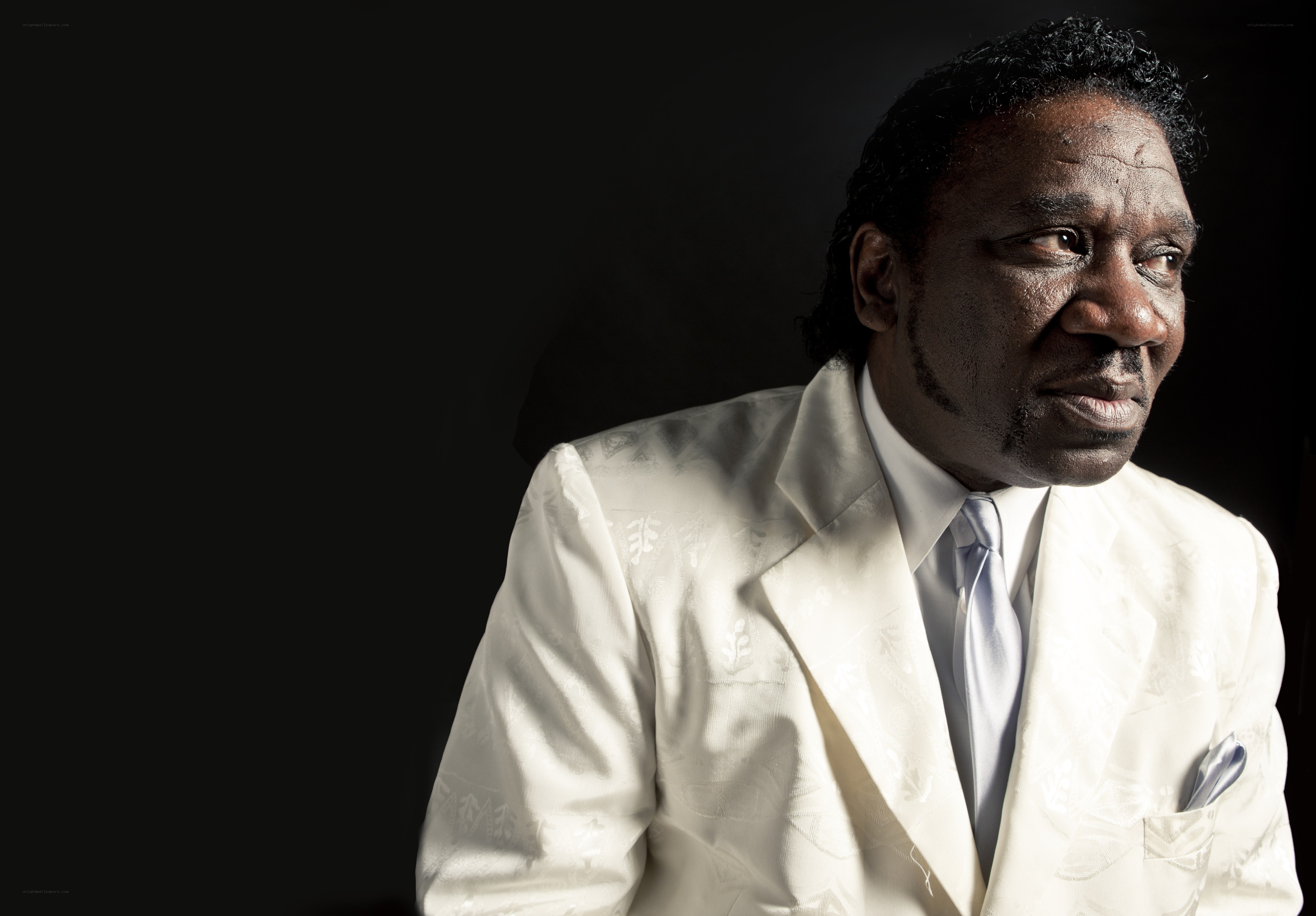 man in white suit portrait