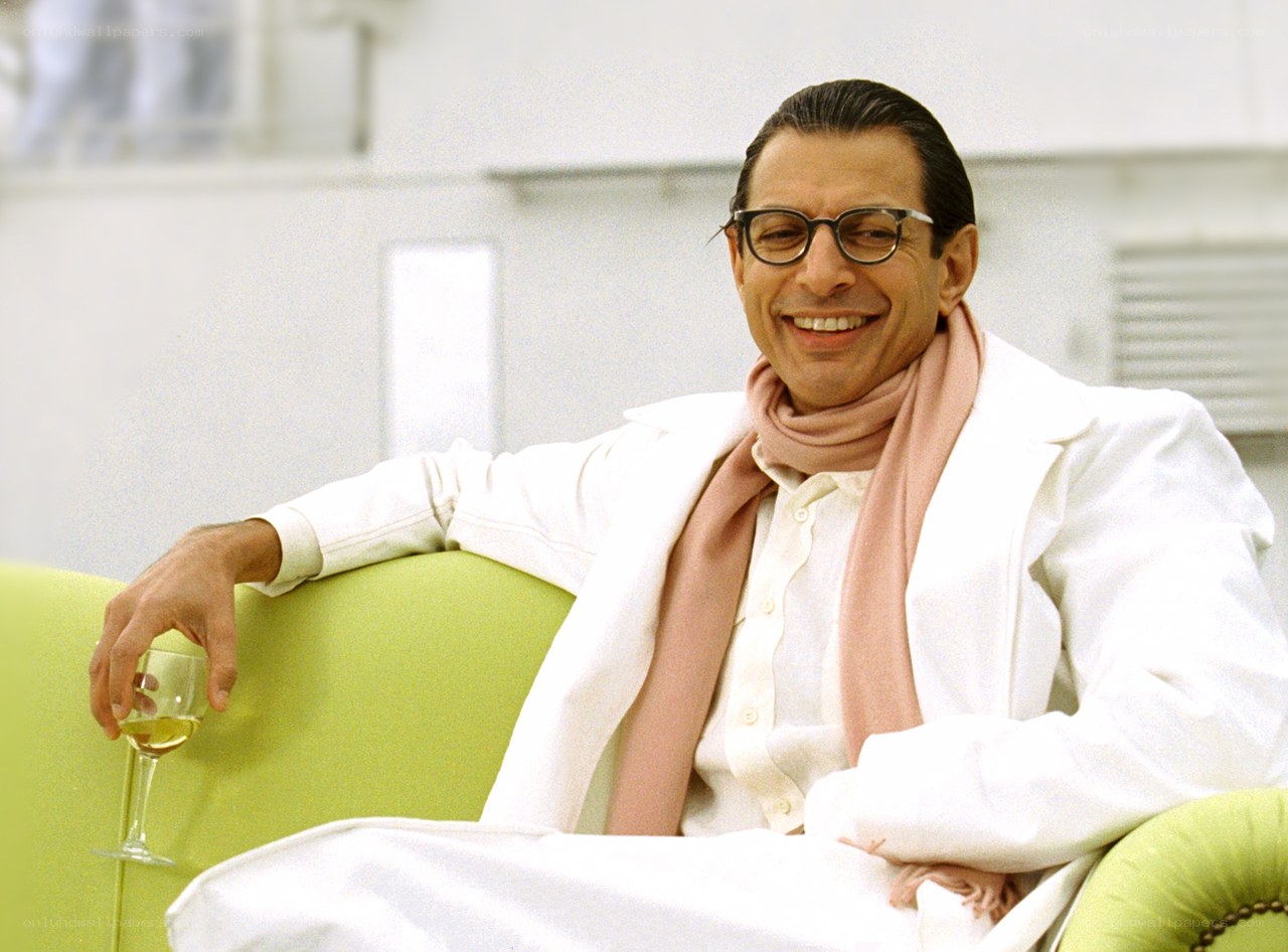 Man in white suit smiling