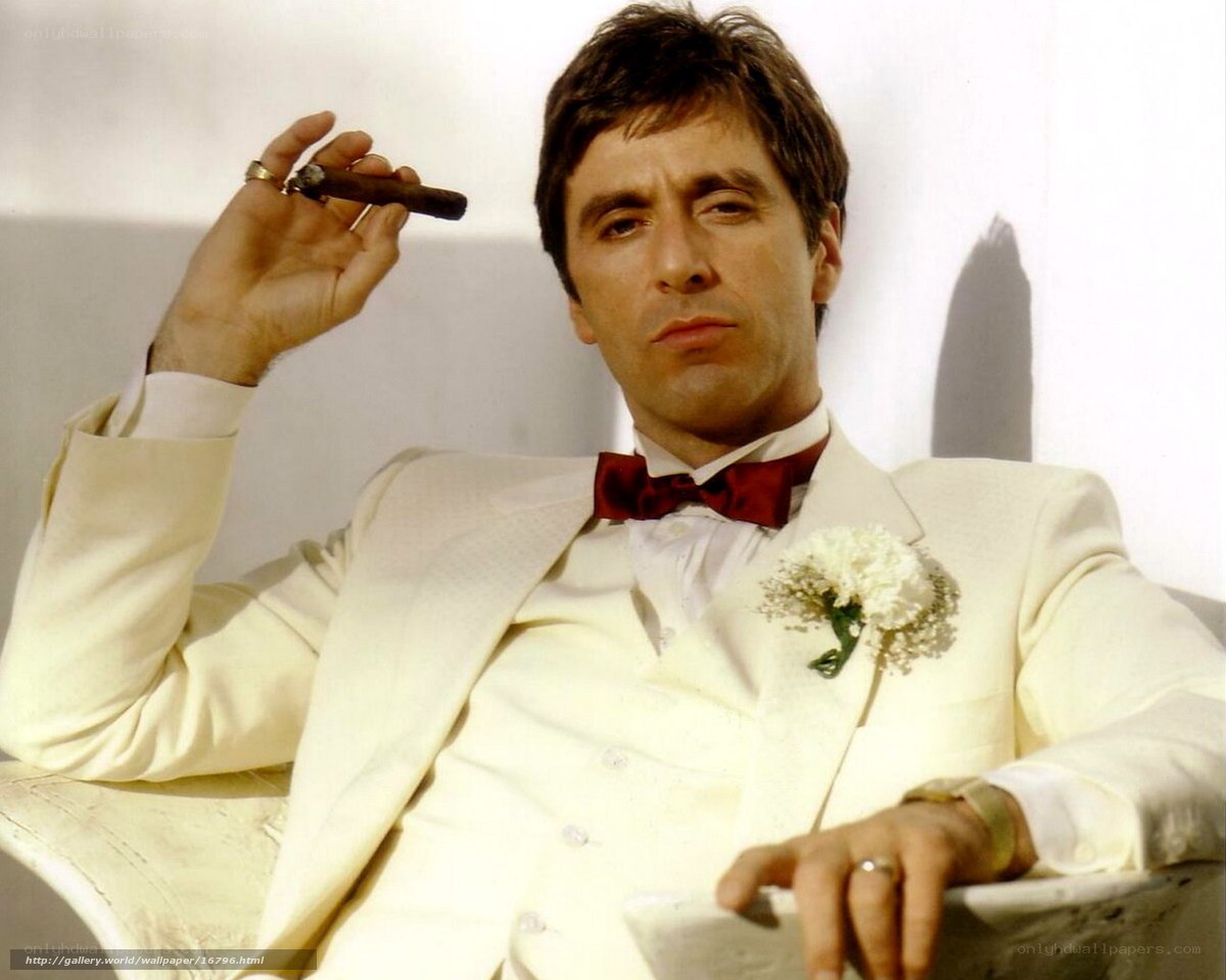 man in white suit with cigar