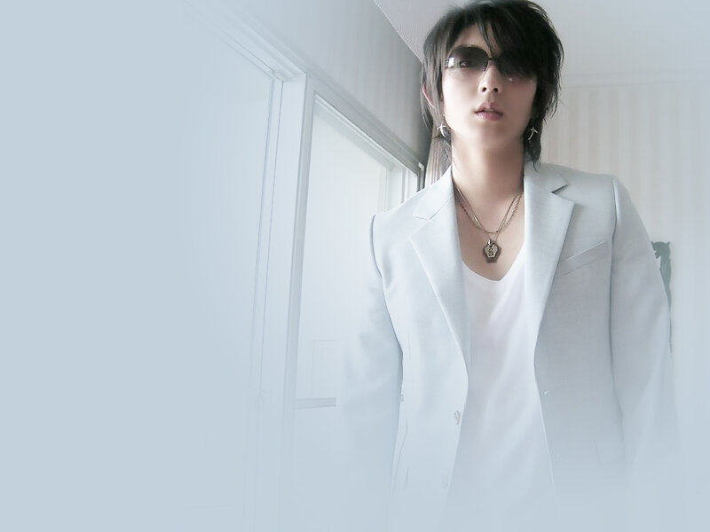 man in white suit with sunglasses