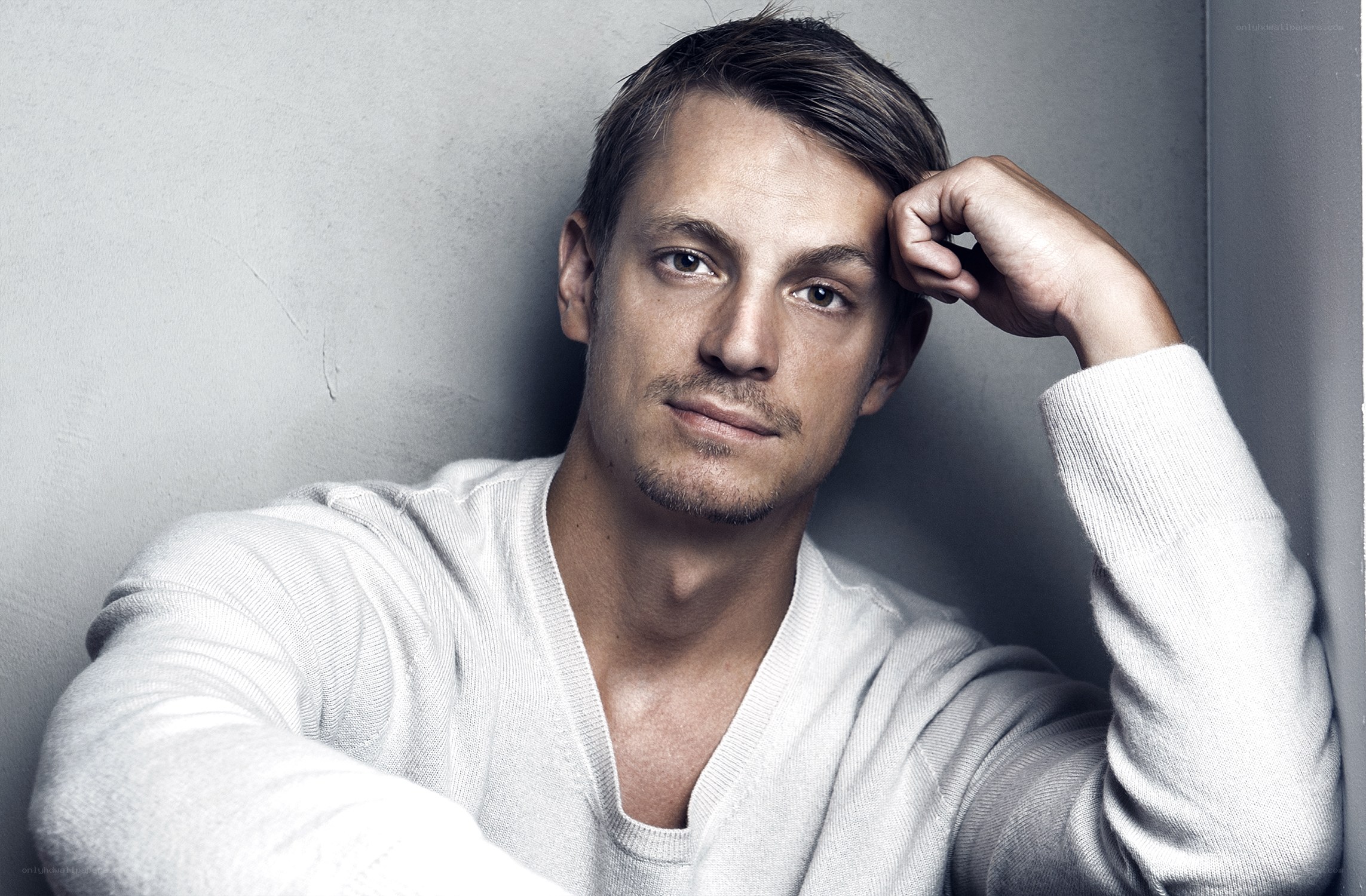 man in white sweater