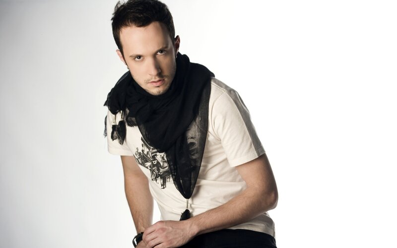 man in white t-shirt and black scarf