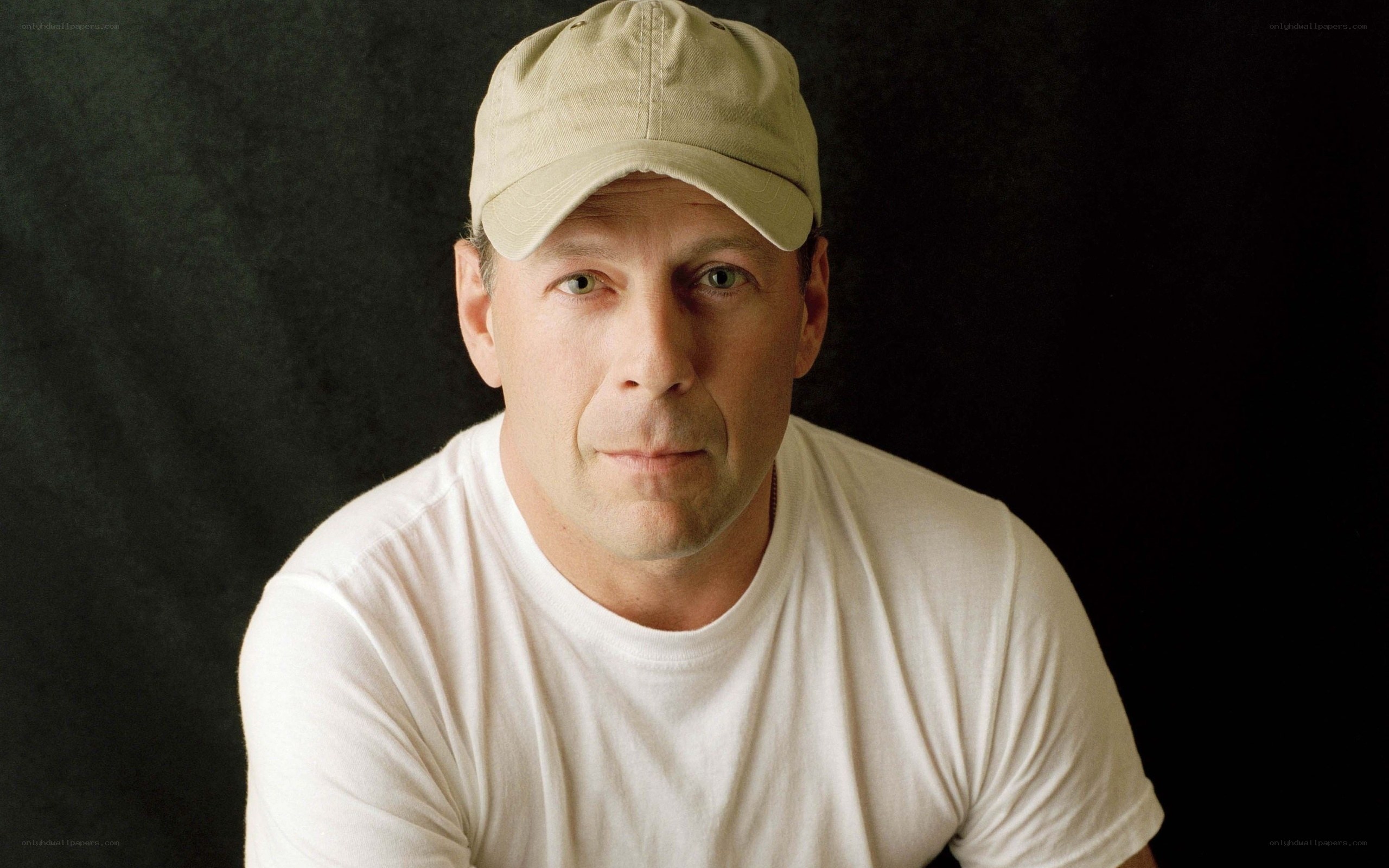 man in white t-shirt and cap