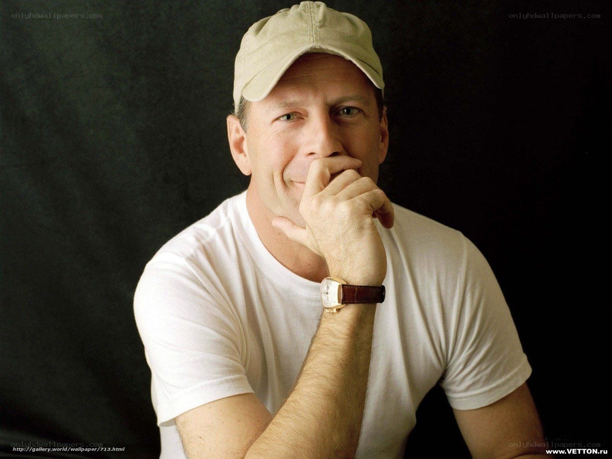 man in white t-shirt and cap