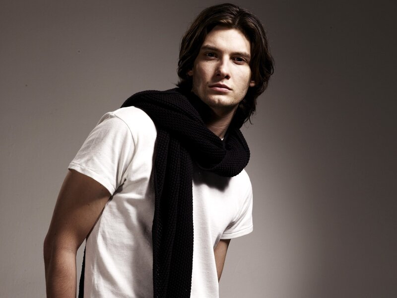 man in white t-shirt and scarf