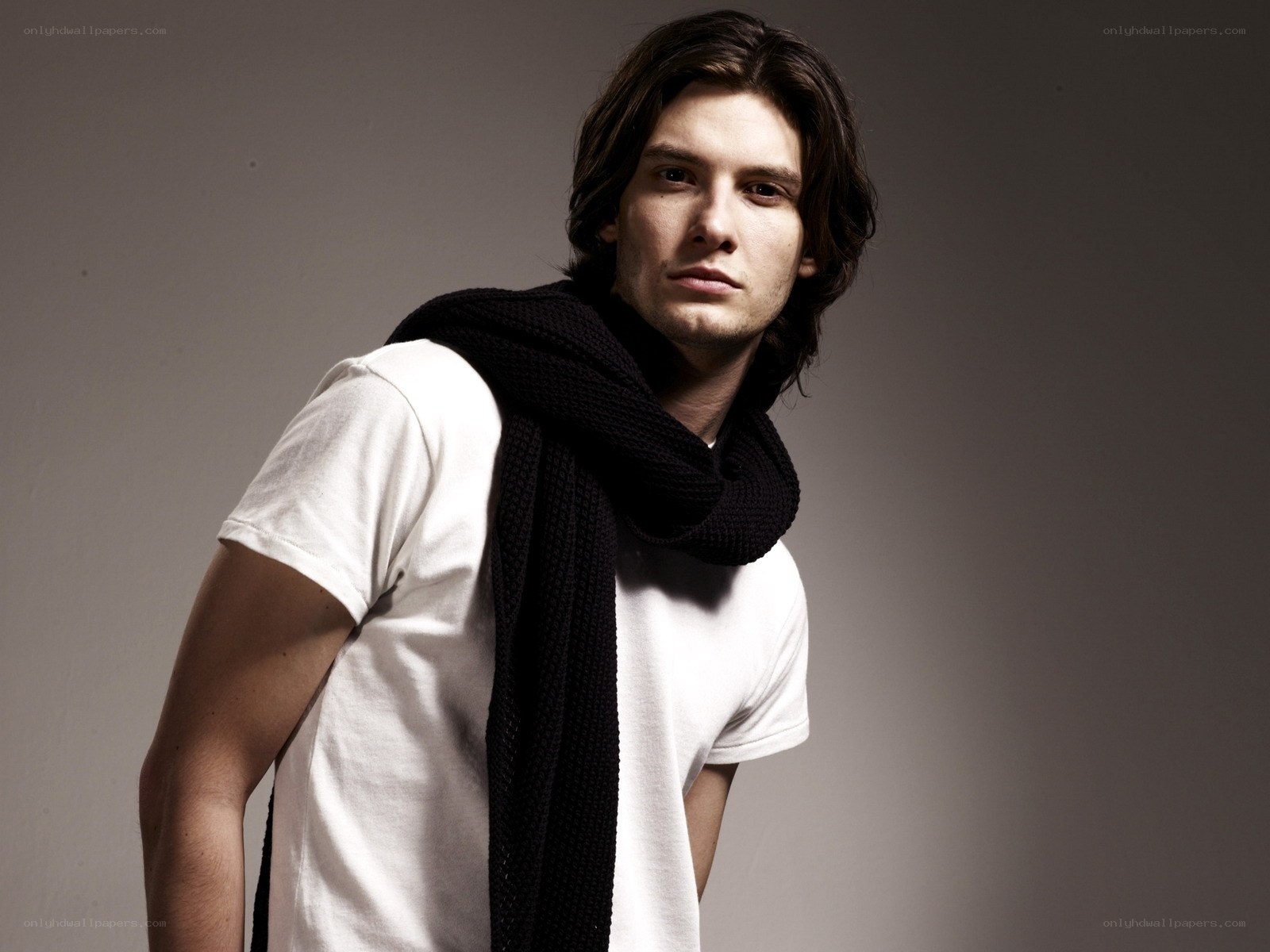 man in white t-shirt and scarf