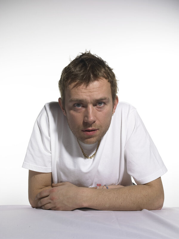man in white t-shirt looking at camera