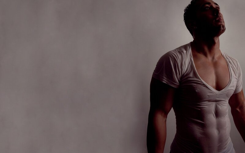 man in white t-shirt looking up