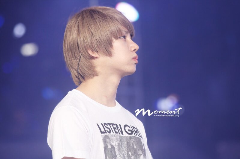 man in white t-shirt on stage