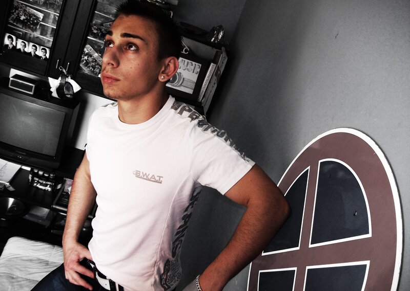 man in white t-shirt sitting