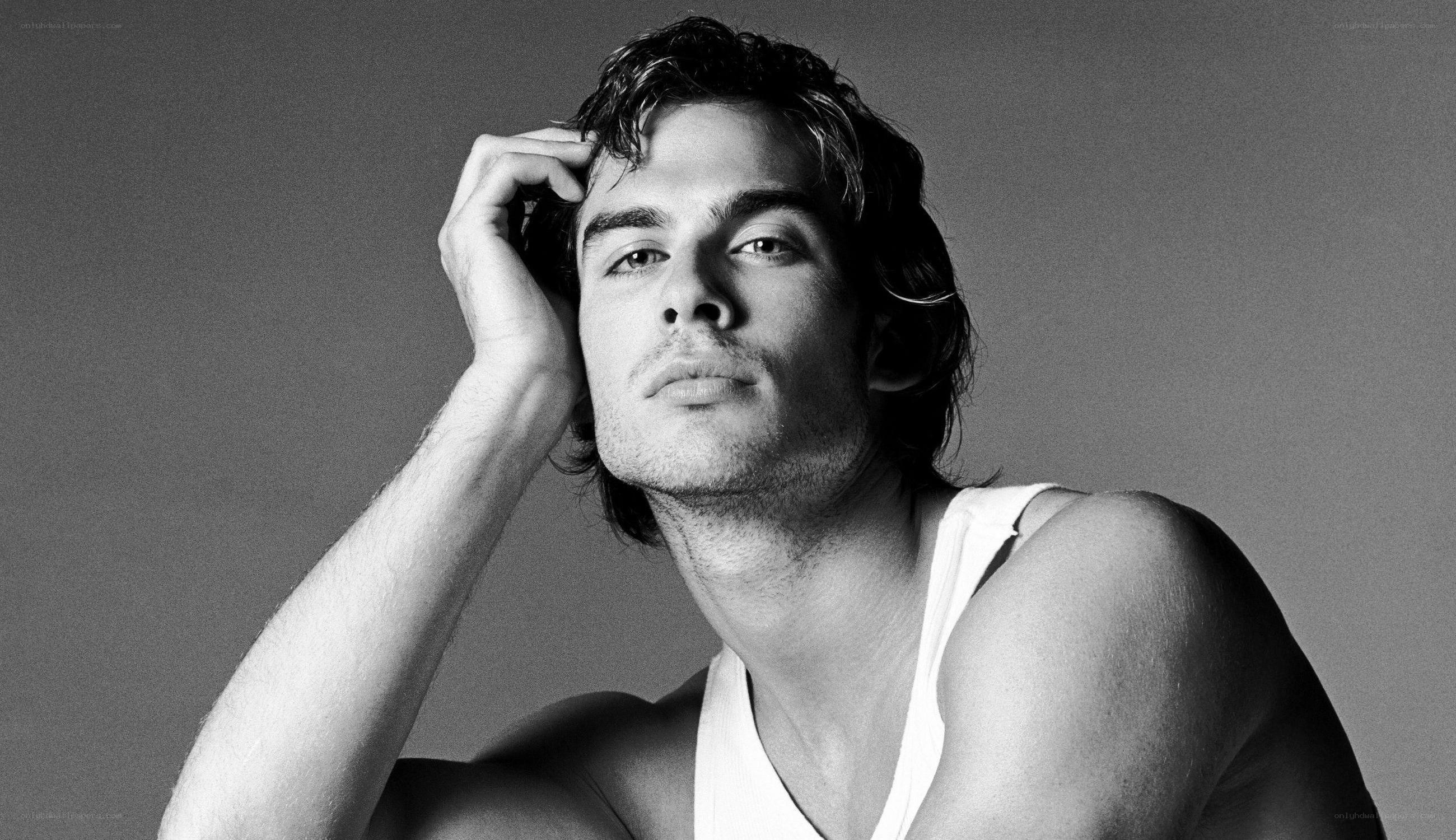 man in white tank top