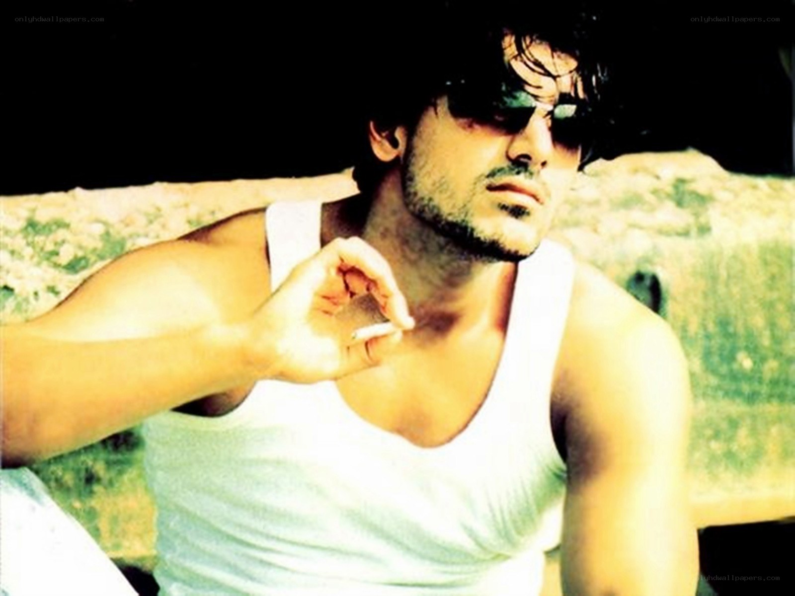 man in white tank top