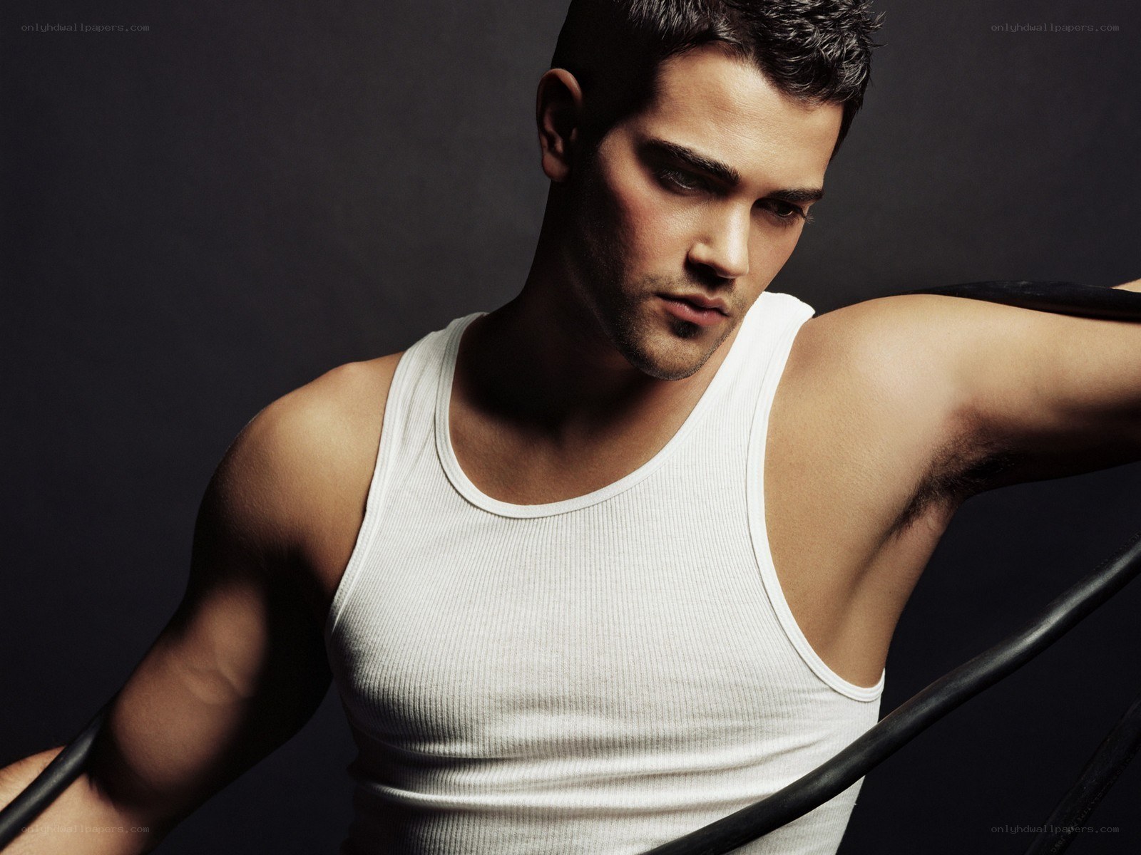 man in white tank top