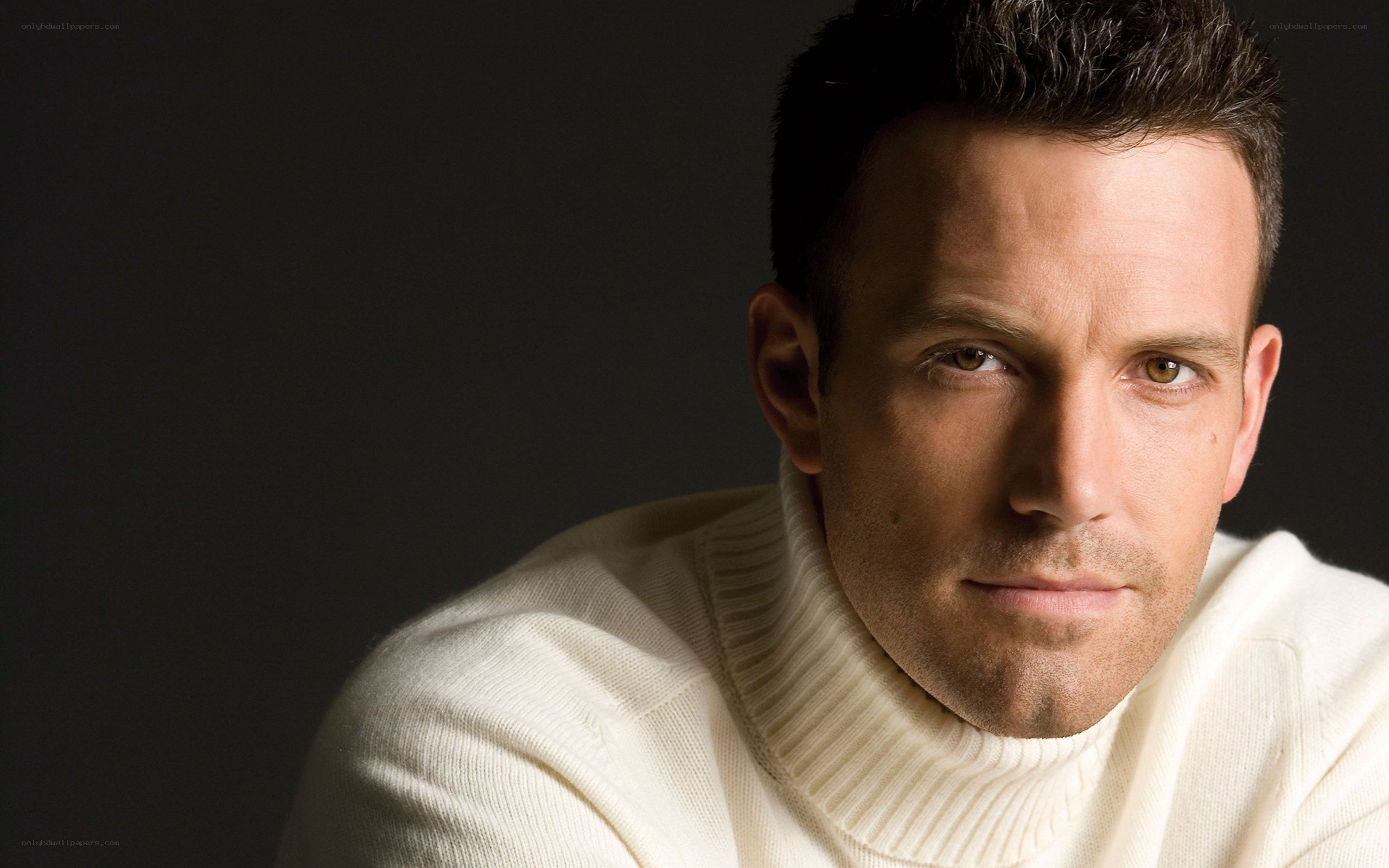 man in white turtleneck