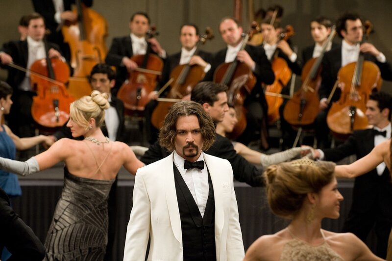 Man in white tuxedo at concert