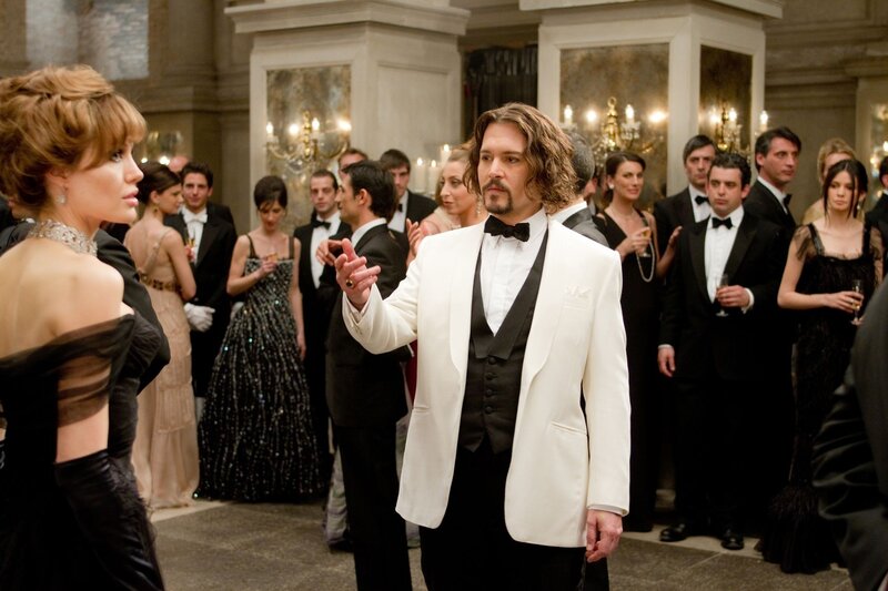 Man in white tuxedo at party