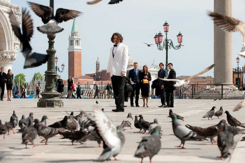 Man in white tuxedo in Venice