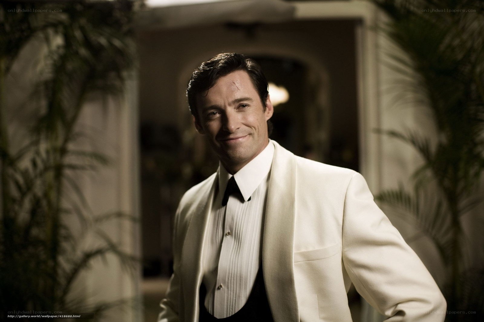 Man in white tuxedo smiling