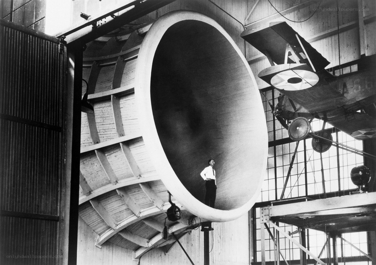 Man in wind tunnel with airplane