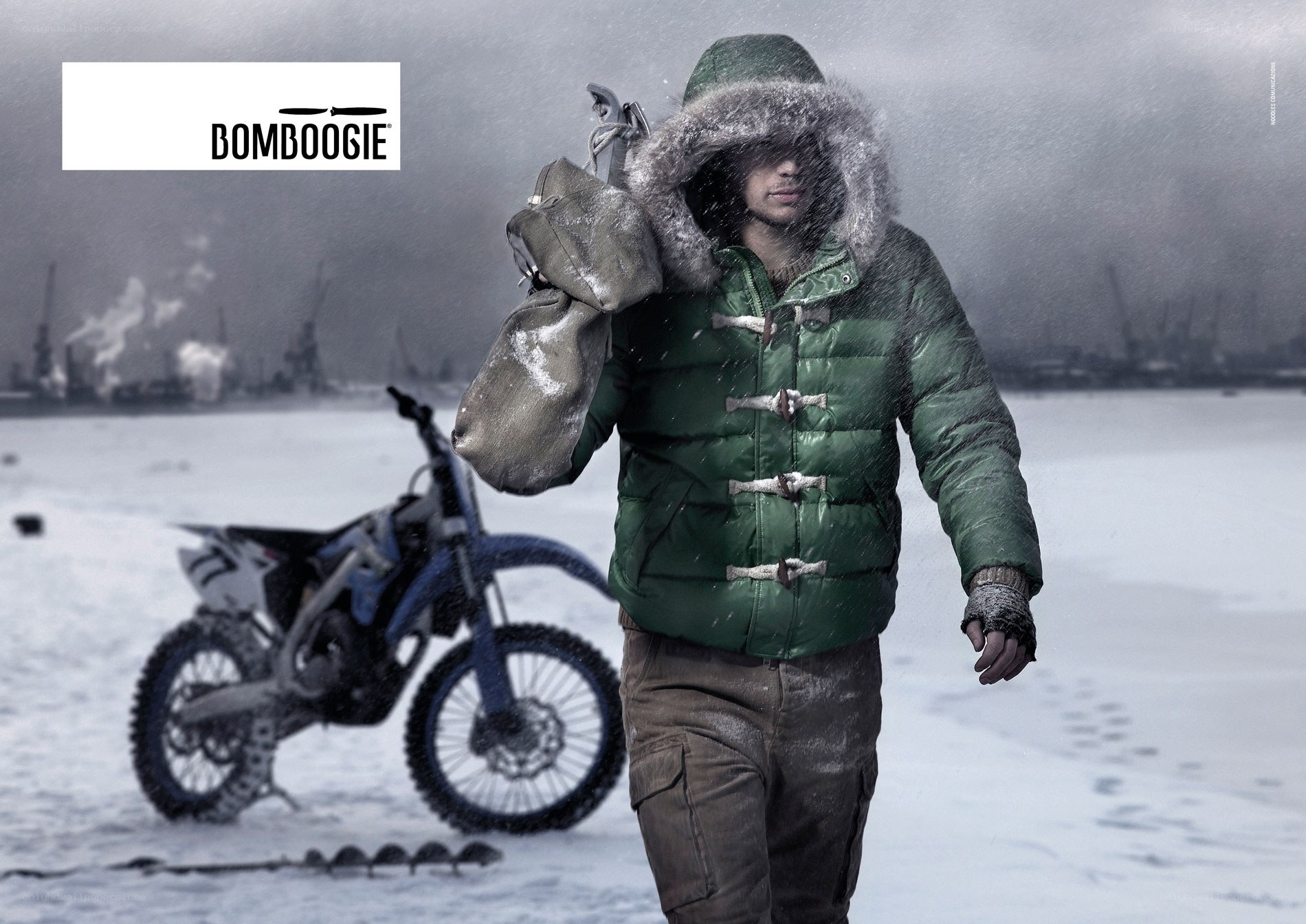 Man in winter gear with motorcycle