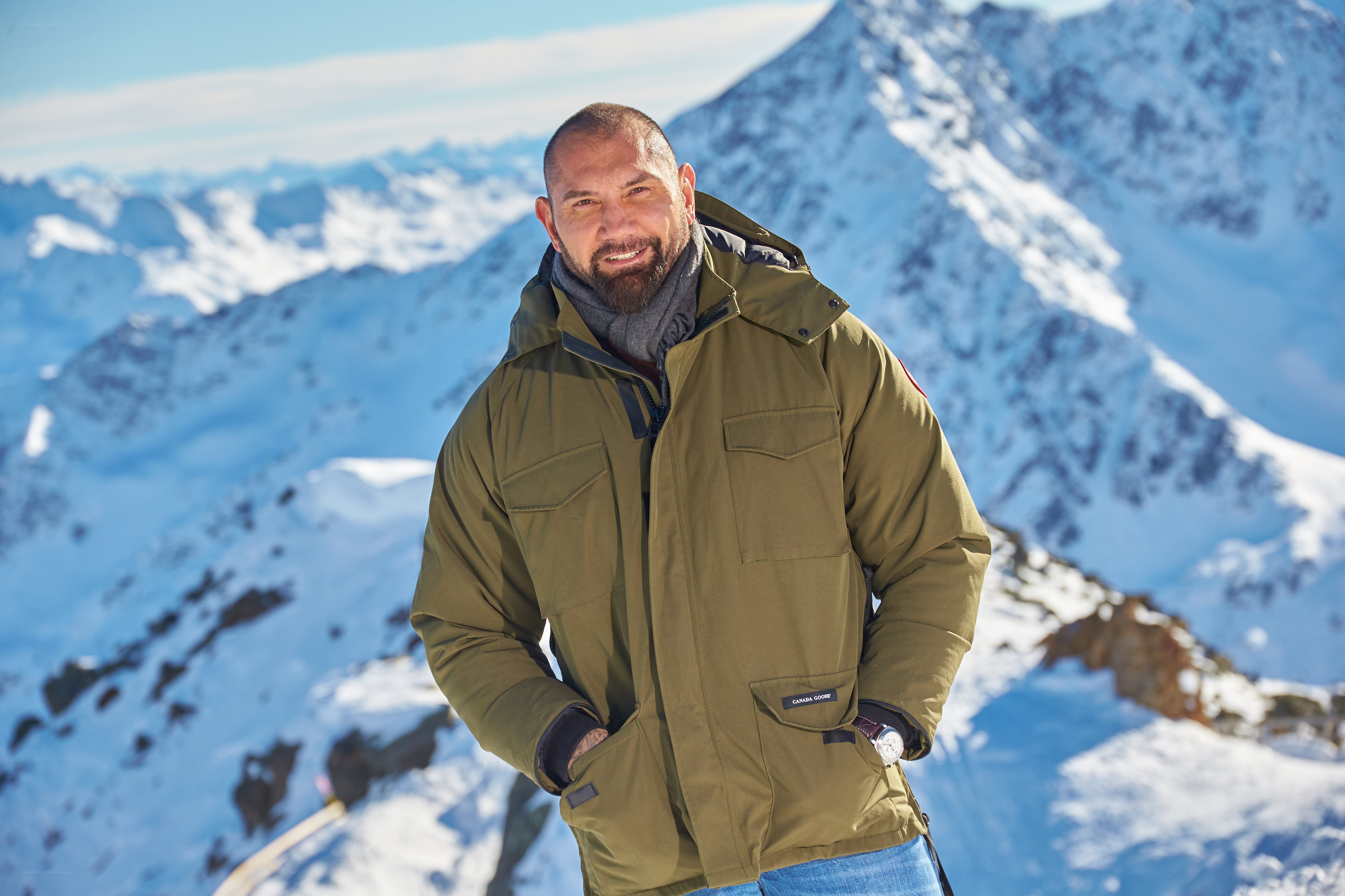 Man in winter jacket on mountain