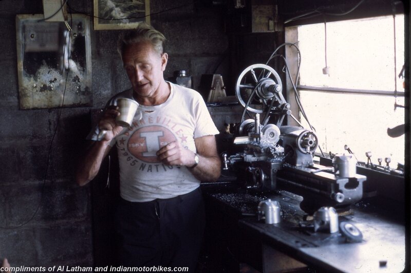 man in workshop with lathe